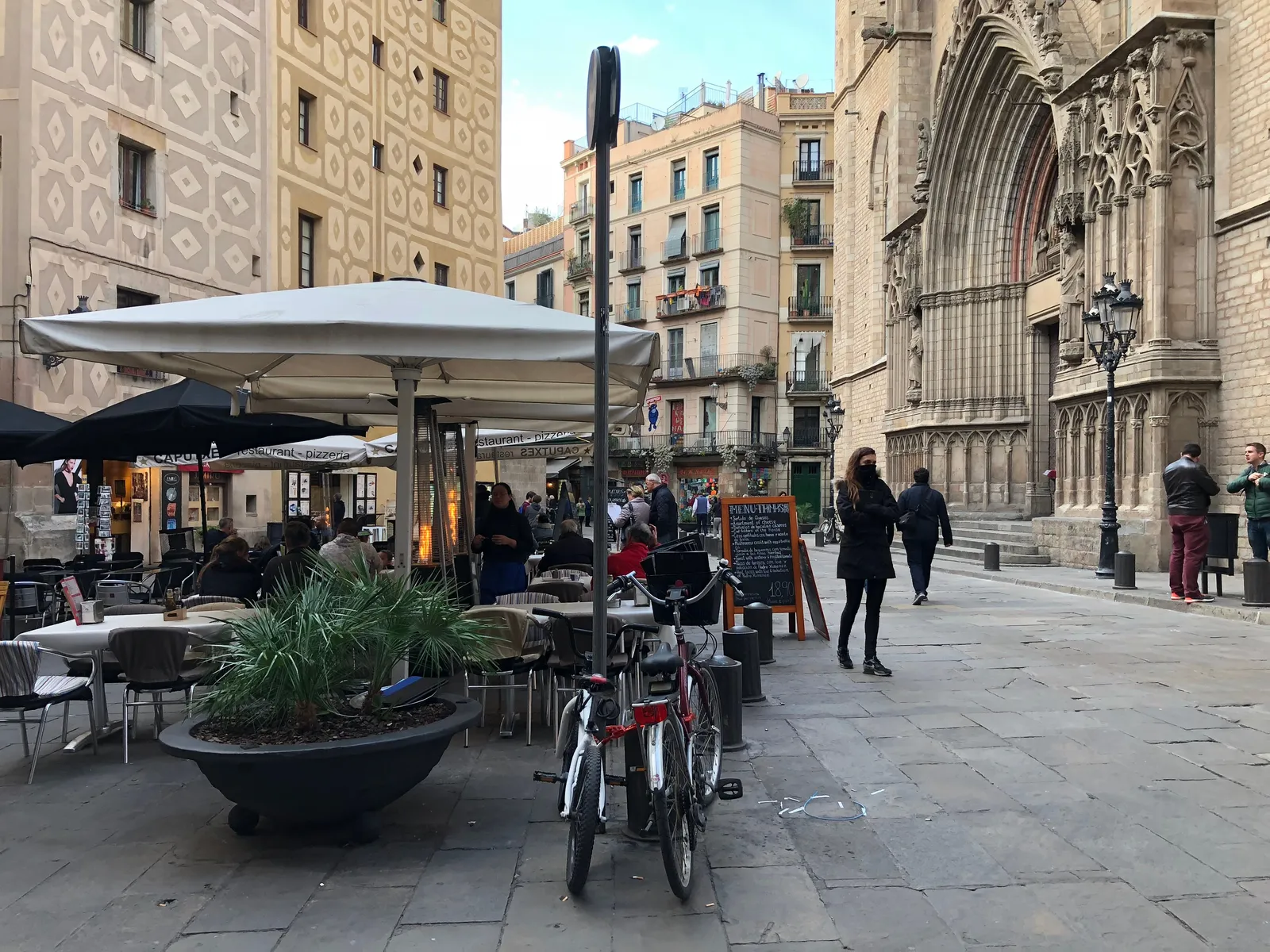 A leafy square with cafe tables in El Born