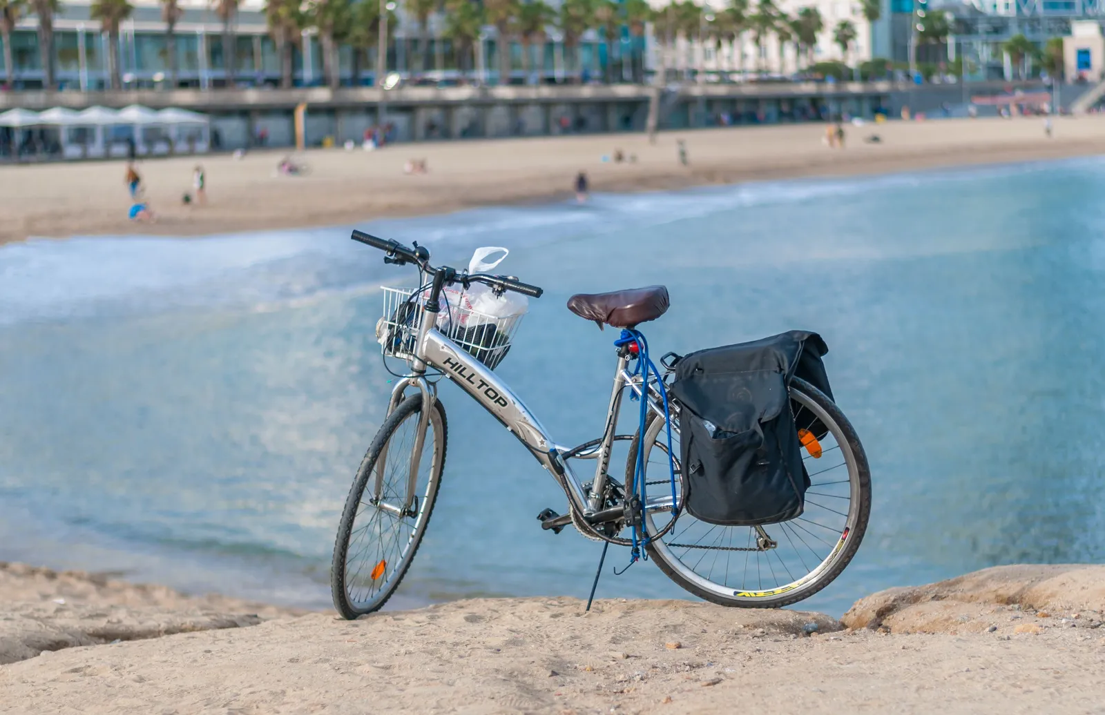 The promenade and cycle path running alongside the sand at Bogatell beach in Barcelona, Spain