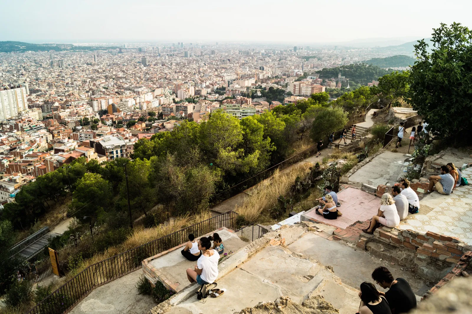 A wide panoramic view over the whole of Barcelona from a hilltop viewpoint at golden hour, Spain