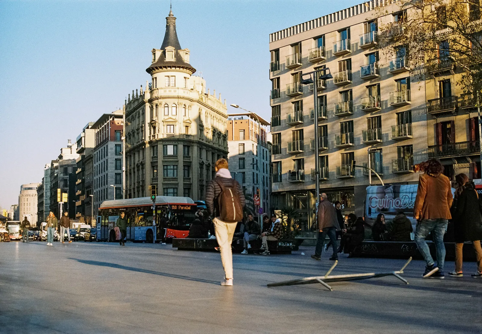A broad modernista avenue in the Eixample district of Barcelona in daylight