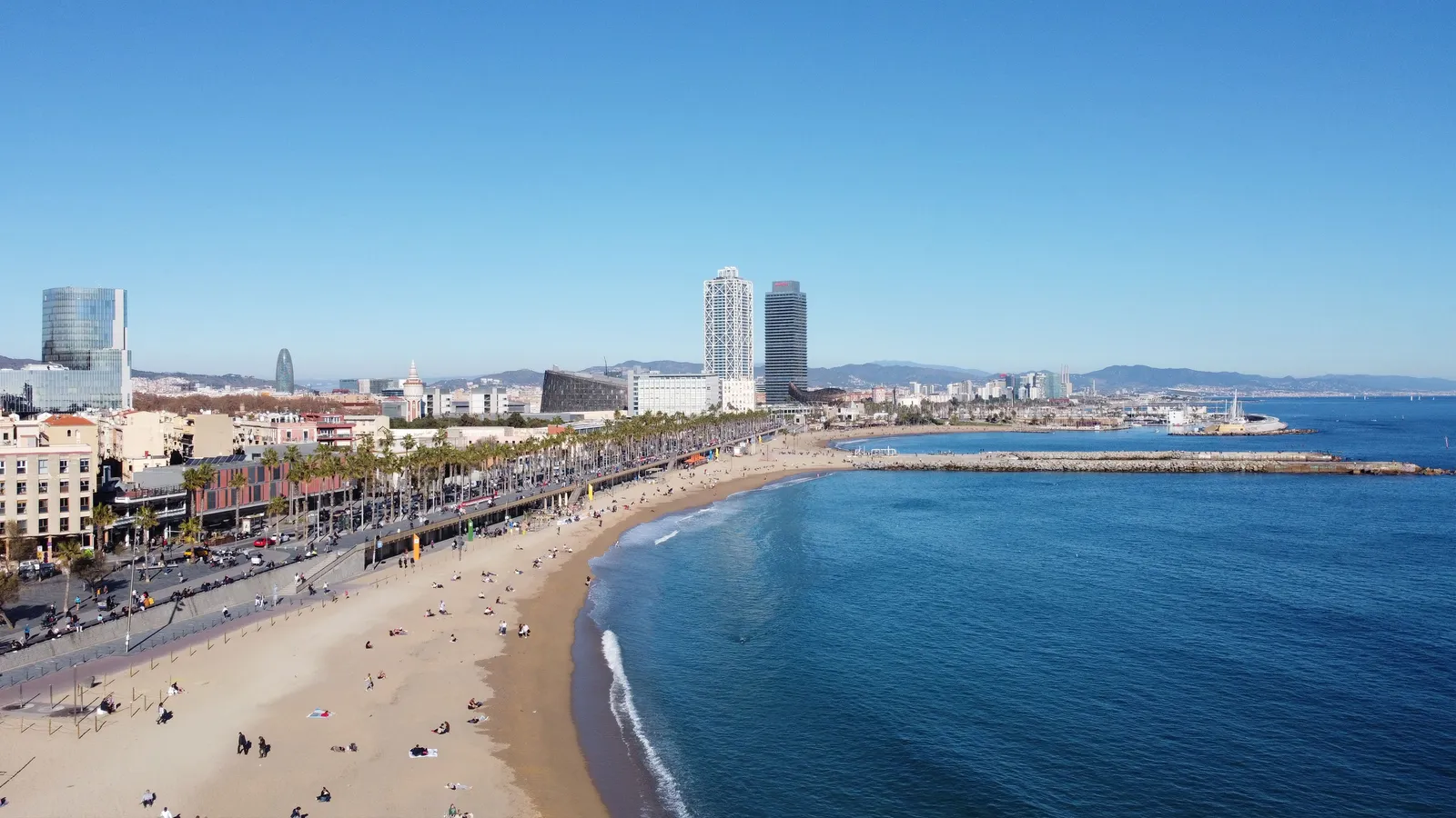 A quieter stretch of Barcelona city beach with calm water