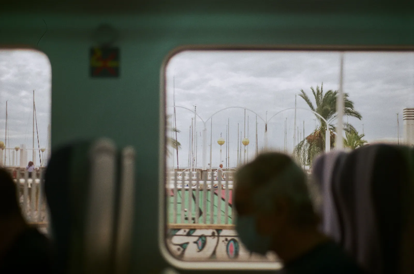 The interior of a Rodalies regional train in Catalonia with the Mediterranean sea visible through the window